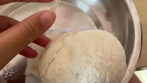 Slow Motion Close Up of Hand Tearing Fluffy Steamed Bun Stock Footage 318004175