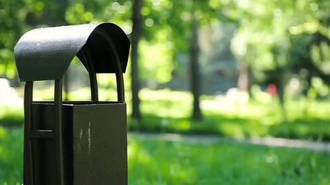 Slow motion close up of a hand throwing out garbage in the waste bin Stock Footage 75984813