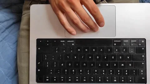 Slow Motion Close-up of Hand Using Laptop Trackpad - 1080p Video stock 334629136