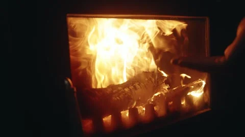 Slow Motion Close-Up: Hand Warming by a Burning Fireplace Stock Footage 342339360