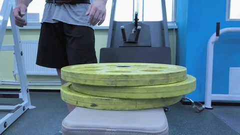 Slow motion. Close-up of Hands   An athletic strong man finished training Video stock 117937855