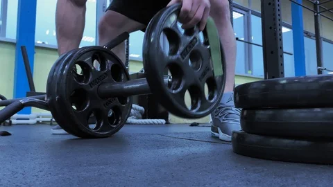 Slow motion. Close-up of Hands   An athletic strong man finished training Video stock 117938409