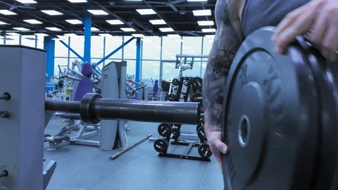 Slow motion. Close-up of Hands   An athletic strong man finished training Stock-Footage 117938494