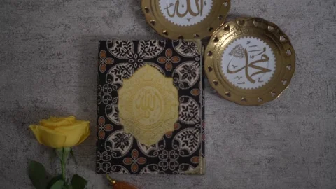 Slow Motion Close-up of Hands Holding and Opening the Holy Quran Stock Footage 341107789