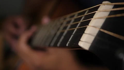 Slow motion close up of hands playing guitar 動画素材 160560749