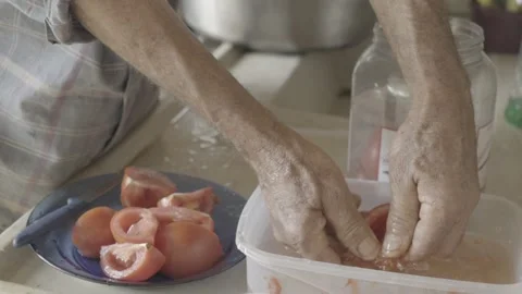 Slow Motion Close-up of Hands Removing Seeds from Freshly Harvested Tomato Stock Footage 320634626