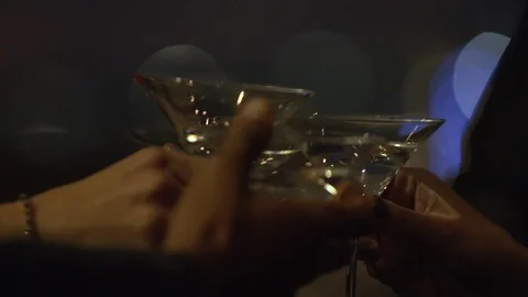 Slow motion close up of hands toasting with cocktail glasses Stock Footage 117066019
