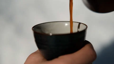 Slow motion of close-up of hot coffee being poured into a mug. Stock-Footage 131272001