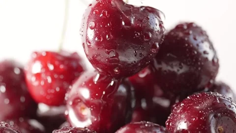 Slow-motion close-up of juicy cherry berries with water droplets, emphasizi.. Stock Footage 312870786