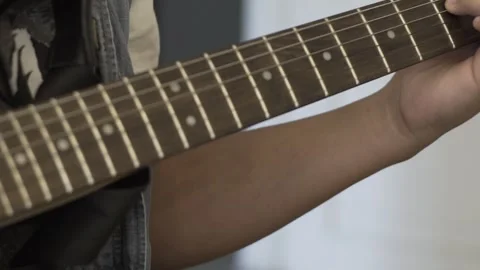 Slow Motion Close Up Of Kid Playing An Electric Guitar Stock Footage 300728239