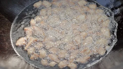 Slow motion close-up of lamb tail fat rendering in cauldron during first st.. Stock Footage 319660977