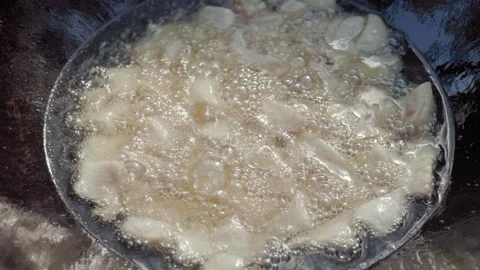 Slow motion close-up of lamb tail fat rendering in cauldron during first st.. Stock Footage 319661261