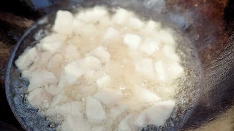 Slow motion close-up of lamb tail fat rendering in cauldron during first st.. Stock Footage 319661277