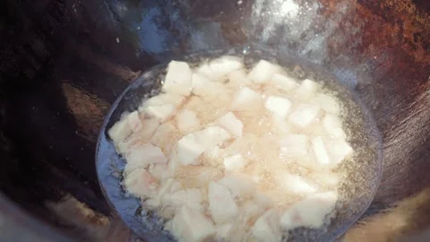 Slow motion close-up of lamb tail fat rendering in cauldron during first st.. Stock Footage 319661521