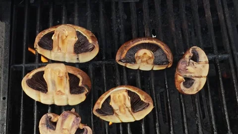 Slow Motion Close Up of Large Juicy Shiitake Mushrooms Grilling on Black BBQ Stock Footage 339217687