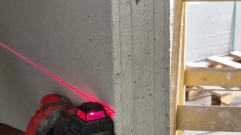 Slow Motion Close Up of Laser Level Line on Wall Panel Stock Footage 332932090