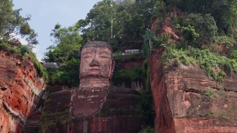 Slow motion close-up of Leshan Giant Buddha face from below Stock Footage 315680552