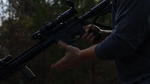 Slow Motion Close Up Loading A Magazine Into An Assault Rifle Stock-Footage 125540623