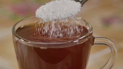 Slow Motion Close Up Locked Down Shot of White Sugar Crystals Falling Off Spo Stock-Footage 144820509