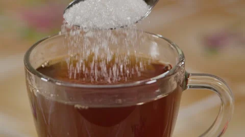 Slow Motion Close Up Locked Down Shot of White Sugar Crystals Falling Off Spo 库存影片 162752623