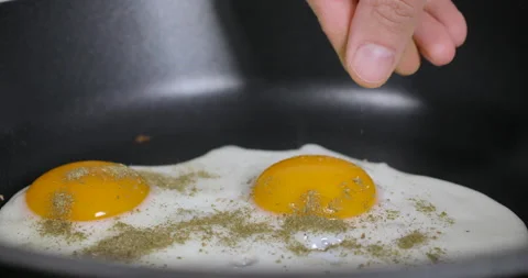 Slow Motion Close Up Man Cooking Fried Eggs on Frying Pan For Breakfast, Kitc Stock Footage 148157281