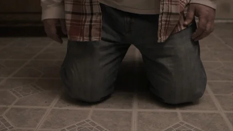 Slow motion close up of a man falling to his knees and shaking the camera Stock-Footage 91840678