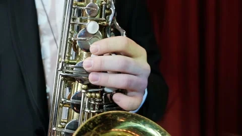 SLOW MOTION close up of man playing on old saxophone. Jazz player rehearsing Stock Footage 106328015