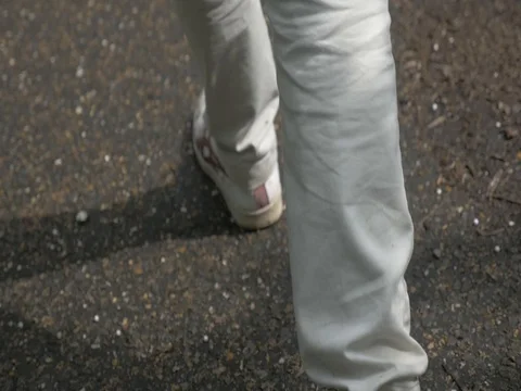 Slow motion close up of man walking. Stock Footage 70319313