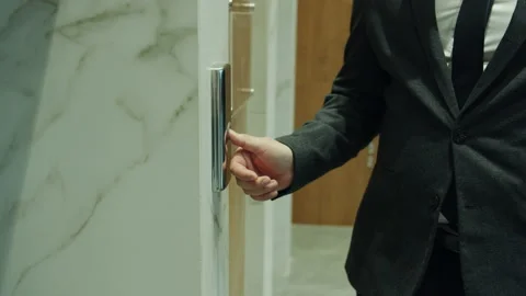 Slow motion close-up of man's hand pressing elevator button in business center Video stock 147838293