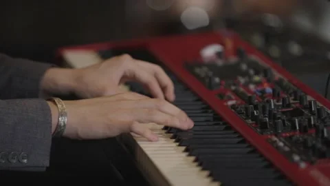 Slow motion close up of man's hands playing piano/keyboards Stock Footage 204765442