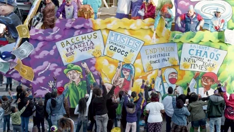 Slow Motion Close-Up of Mardi Gras Parade Float and Excited Crowd Catching Stock Footage 320992245