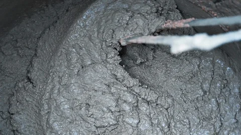 Slow motion, Close up, mortar ingredients mixed in concrete mixer for Stock Footage 129249563