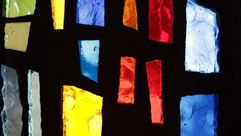 Slow motion close move down colored glass window Vídeos de archivo 106149200