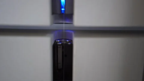 Slow motion close up of multiple threads being passed through a thread tester Stock Footage 257762568