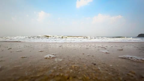 Slow Motion Close-Up of Ocean Waves Crashing on Sandy Beach Shoreline Stock Footage 331077387