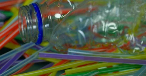 Slow Motion Close Up Panoramic View Of Plastic Bottles With Straws Polluting  Stock Footage 113387802