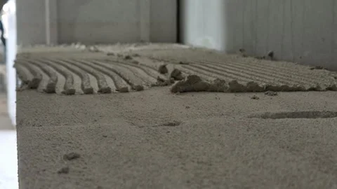 Slow motion close up of placing aerated concrete block Stock Footage 336895839