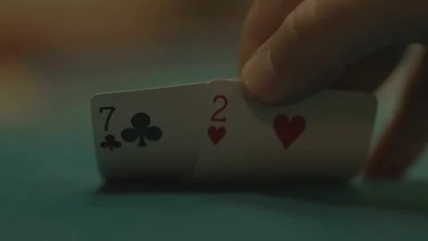 Slow motion close-up player looking at cards and hand 库存影片 334037273