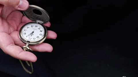 Slow Motion Close-Up of Pocket Watch on Chain Being Stored (Full HD) Stock Footage 296949921