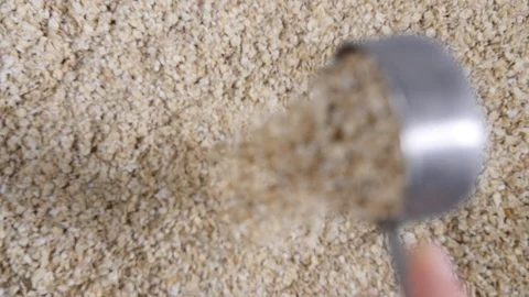 Slow motion close up of porridge breakfast oats with a stainless steel Stock Footage 88338906