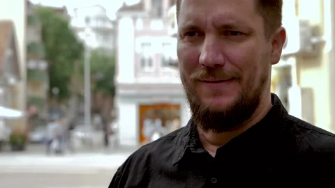 Slow motion of close up portrait of bearded man which drinks beer outdoors Stock Footage 130490539