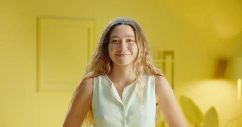 Slow motion close up of a portrait of cute young female model looking and Stock Footage 188095203