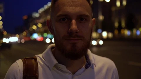 Slow motion close up portrait of handsome bearded man in white polo on the Stock Footage 112827545
