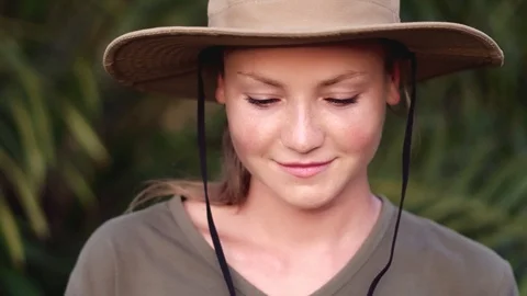 Slow motion. Close-up portrait of a young, beautiful and happy woman in tropical Video stock 87475273