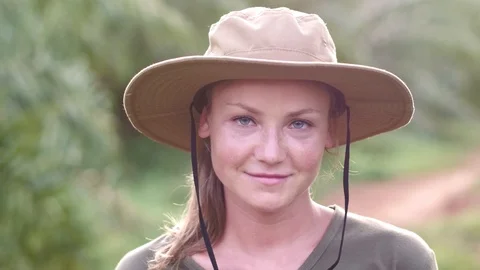 Slow motion. Close-up portrait of a young, beautiful and happy woman in tropical Stock Footage 87475488