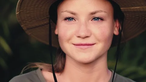 Slow motion. Close-up portrait of a young, beautiful and happy woman in tropical Video stock 249150749