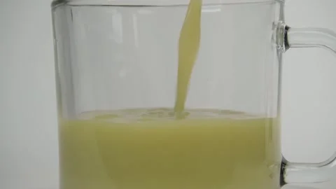 Slow motion close up of pouring matcha or green tea Stock Footage 278030739
