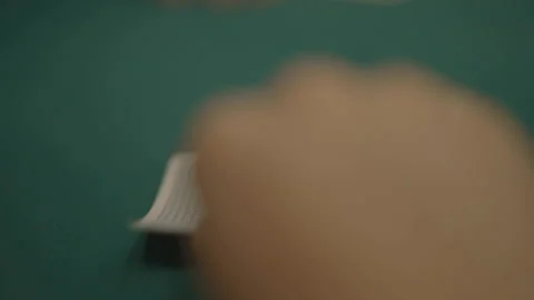 Slow motion close-up POV of player flipping cards Stock Footage 334037384