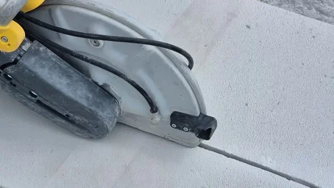 Slow motion close up of power cutter cutting concrete wall Stock Footage 340276251