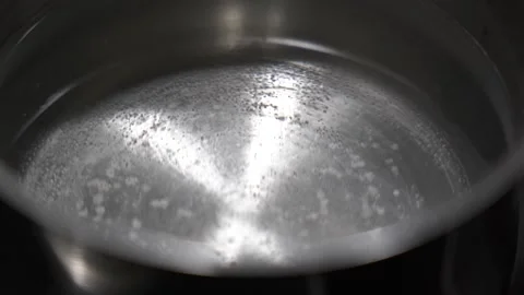 Slow motion close up pre-boiling pasta water. Stock Footage 339805924